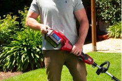 Toro battery string grass trimmer - loading the battery