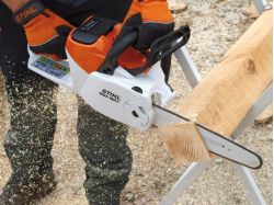 Stihl Battery Chainsaw MSA 160 cutting a block